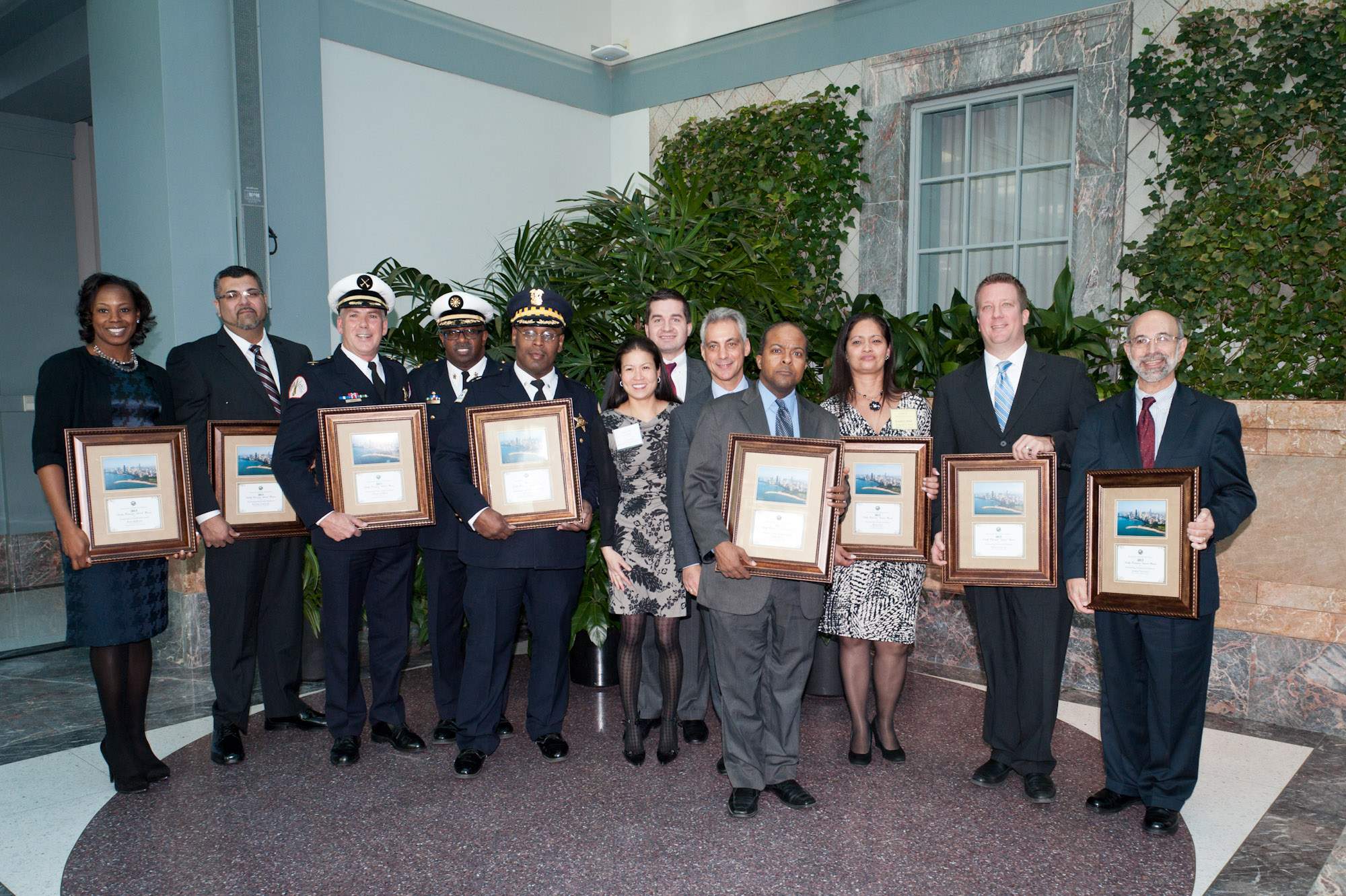 Mayor Rahm Emanuel, Department of Human Resources Commissioner Soo Choi, and John Kedzierski, Director, Motorola Solutions with the 2013 Kathy Osterman Award Recipients.